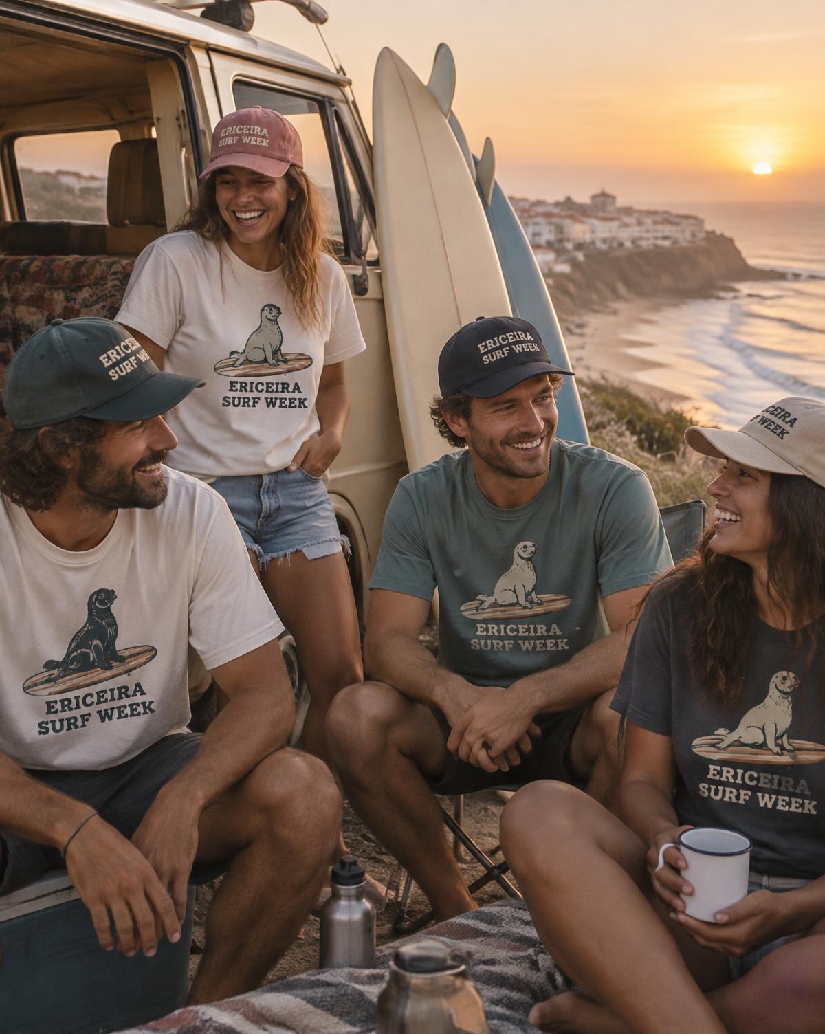 Friends in Ericeira Surf Week tees and stitched caps laughing beside a camper van and surfboards.